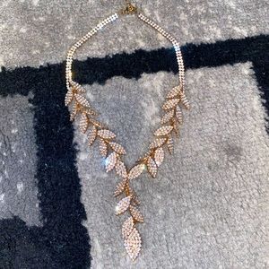 Iced out leaf tassel necklace